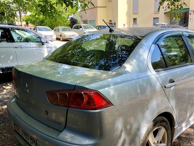 Серый Мицубиси Лансер, объемом двигателя 2 л и пробегом 295 тыс. км за 6200 $, фото 3 на Automoto.ua