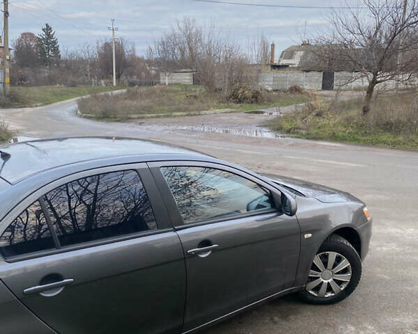 Серый Мицубиси Лансер, объемом двигателя 1.5 л и пробегом 255 тыс. км за 6500 $, фото 16 на Automoto.ua