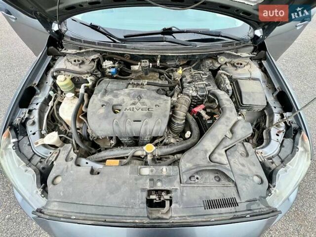 Серый Мицубиси Лансер, объемом двигателя 2 л и пробегом 203 тыс. км за 4999 $, фото 19 на Automoto.ua