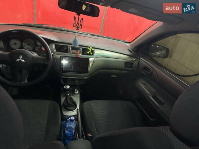 Серый Мицубиси Лансер, объемом двигателя 1.6 л и пробегом 268 тыс. км за 4600 $, фото 12 на Automoto.ua