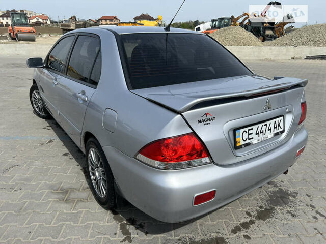 Сірий Міцубісі Lancer, об'ємом двигуна 1.6 л та пробігом 150 тис. км за 4999 $, фото 5 на Automoto.ua