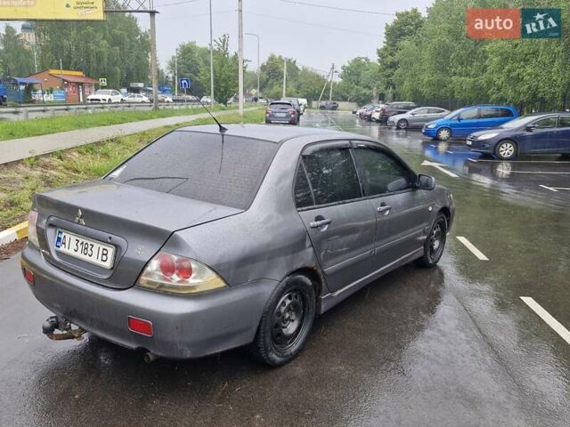 Сірий Міцубісі Lancer, об'ємом двигуна 1.58 л та пробігом 245 тис. км за 2650 $, фото 2 на Automoto.ua