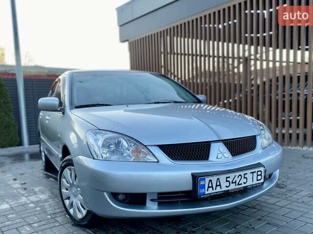 Серый Мицубиси Лансер, объемом двигателя 1.6 л и пробегом 203 тыс. км за 5200 $, фото 1 на Automoto.ua