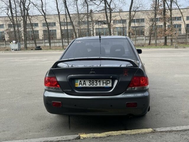 Серый Мицубиси Лансер, объемом двигателя 1.6 л и пробегом 333 тыс. км за 4499 $, фото 5 на Automoto.ua