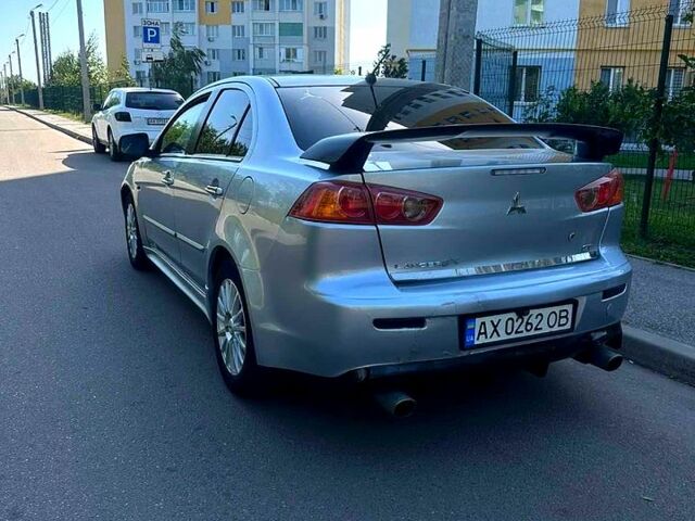 Серый Мицубиси Лансер, объемом двигателя 2 л и пробегом 240 тыс. км за 6500 $, фото 2 на Automoto.ua