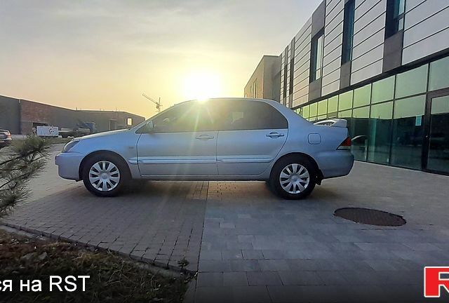 Сірий Міцубісі Lancer, об'ємом двигуна 1.6 л та пробігом 164 тис. км за 4950 $, фото 8 на Automoto.ua