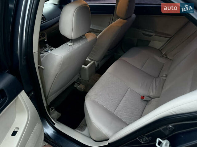 Серый Мицубиси Лансер, объемом двигателя 2 л и пробегом 212 тыс. км за 6000 $, фото 22 на Automoto.ua