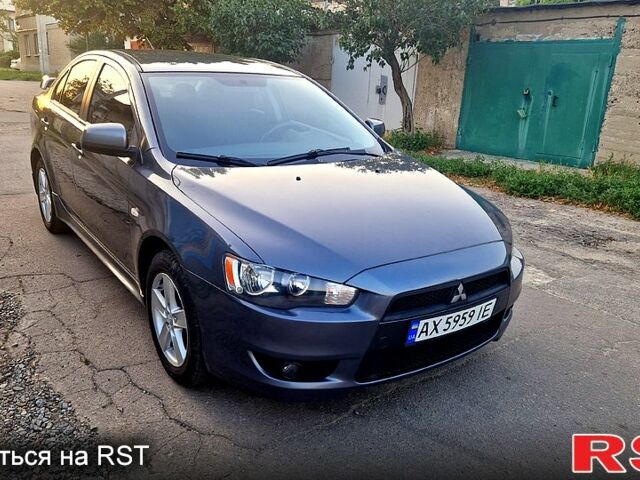 Серый Мицубиси Лансер, объемом двигателя 2 л и пробегом 246 тыс. км за 6500 $, фото 1 на Automoto.ua