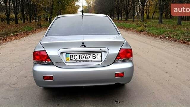 Серый Мицубиси Лансер, объемом двигателя 1.58 л и пробегом 176 тыс. км за 5000 $, фото 1 на Automoto.ua