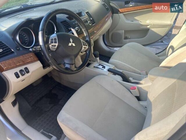 Серый Мицубиси Лансер, объемом двигателя 2 л и пробегом 266 тыс. км за 7000 $, фото 11 на Automoto.ua