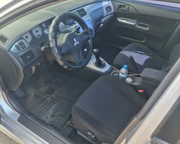 Сірий Міцубісі Lancer, об'ємом двигуна 1.6 л та пробігом 217 тис. км за 6000 $, фото 1 на Automoto.ua