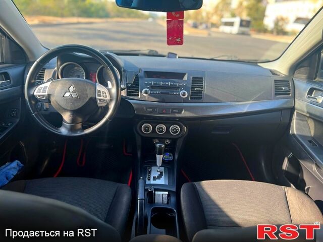 Серый Мицубиси Лансер, объемом двигателя 2 л и пробегом 151 тыс. км за 6099 $, фото 8 на Automoto.ua