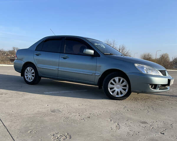 Серый Мицубиси Лансер, объемом двигателя 1.6 л и пробегом 196 тыс. км за 5300 $, фото 6 на Automoto.ua