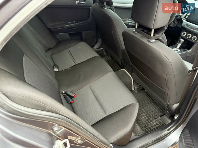 Сірий Міцубісі Lancer, об'ємом двигуна 2 л та пробігом 92 тис. км за 8200 $, фото 38 на Automoto.ua