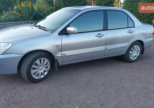 Серый Мицубиси Лансер, объемом двигателя 1.6 л и пробегом 117 тыс. км за 3980 $, фото 8 на Automoto.ua