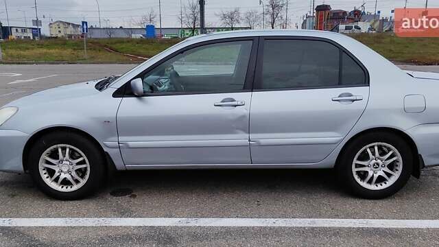 Серый Мицубиси Лансер, объемом двигателя 1.58 л и пробегом 216 тыс. км за 4700 $, фото 14 на Automoto.ua