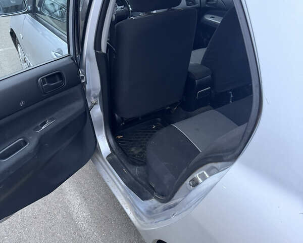 Серый Мицубиси Лансер, объемом двигателя 1.58 л и пробегом 330 тыс. км за 3500 $, фото 10 на Automoto.ua