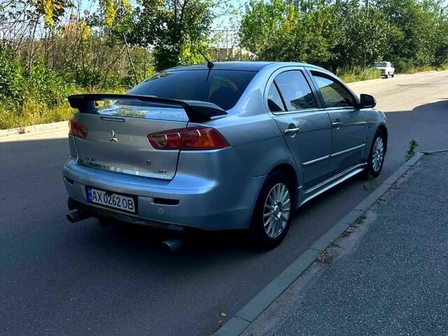 Серый Мицубиси Лансер, объемом двигателя 2 л и пробегом 240 тыс. км за 6500 $, фото 1 на Automoto.ua