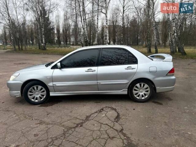 Сірий Міцубісі Lancer, об'ємом двигуна 1.6 л та пробігом 254 тис. км за 3800 $, фото 7 на Automoto.ua