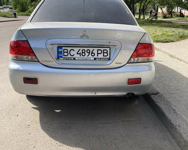 Сірий Міцубісі Lancer, об'ємом двигуна 1.58 л та пробігом 211 тис. км за 4400 $, фото 5 на Automoto.ua