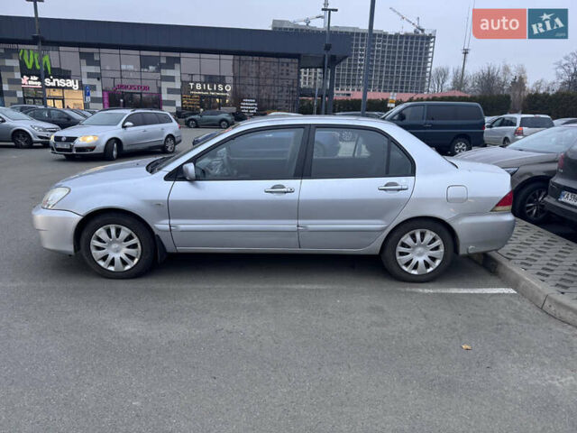 Серый Мицубиси Лансер, объемом двигателя 1.58 л и пробегом 330 тыс. км за 3500 $, фото 21 на Automoto.ua