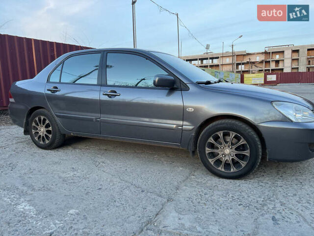 Сірий Міцубісі Lancer, об'ємом двигуна 1.6 л та пробігом 200 тис. км за 4600 $, фото 5 на Automoto.ua