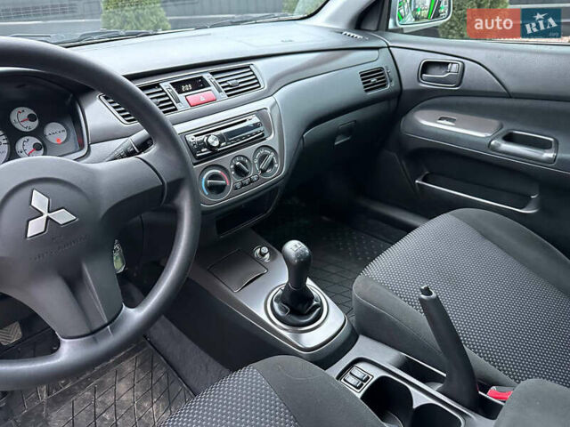 Серый Мицубиси Лансер, объемом двигателя 1.58 л и пробегом 34 тыс. км за 7500 $, фото 15 на Automoto.ua