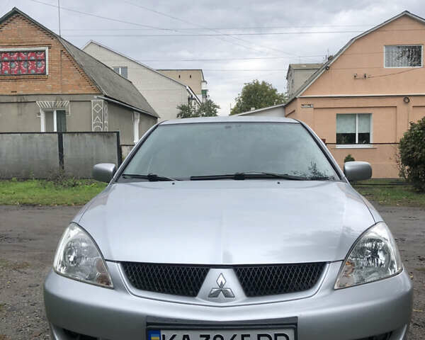 Сірий Міцубісі Lancer, об'ємом двигуна 1.58 л та пробігом 240 тис. км за 4299 $, фото 12 на Automoto.ua