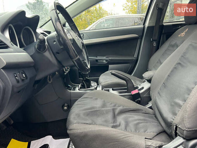 Серый Мицубиси Лансер, объемом двигателя 1.5 л и пробегом 239 тыс. км за 6000 $, фото 9 на Automoto.ua