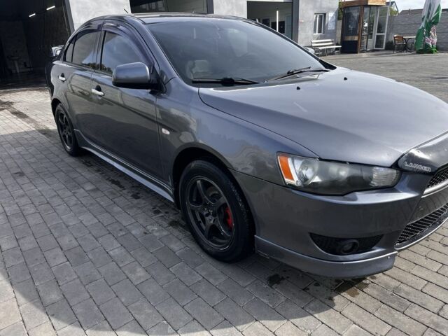 Серый Мицубиси Лансер, объемом двигателя 2 л и пробегом 224 тыс. км за 6500 $, фото 1 на Automoto.ua