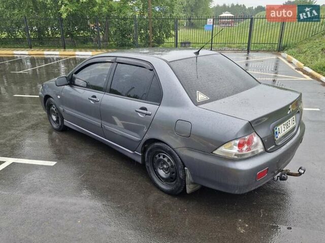 Сірий Міцубісі Lancer, об'ємом двигуна 1.58 л та пробігом 245 тис. км за 2650 $, фото 5 на Automoto.ua