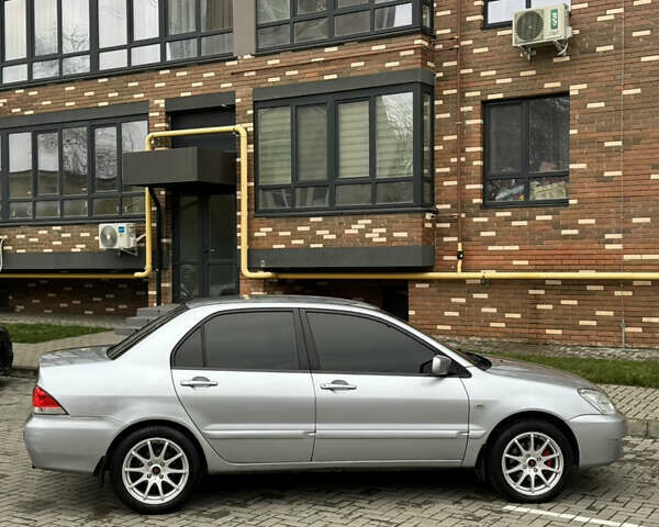 Сірий Міцубісі Lancer, об'ємом двигуна 1.6 л та пробігом 269 тис. км за 3999 $, фото 13 на Automoto.ua