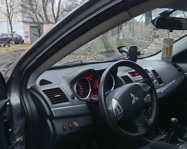 Сірий Міцубісі Lancer, об'ємом двигуна 2 л та пробігом 186 тис. км за 6000 $, фото 17 на Automoto.ua