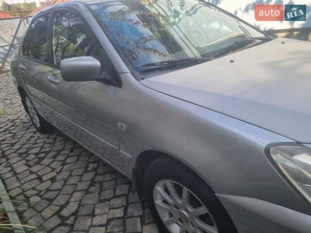 Сірий Міцубісі Lancer, об'ємом двигуна 1.6 л та пробігом 290 тис. км за 3850 $, фото 11 на Automoto.ua