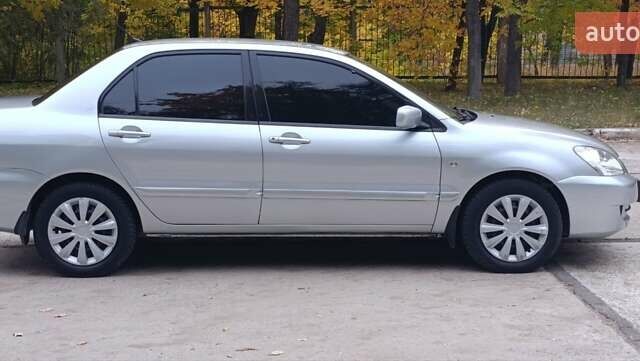 Сірий Міцубісі Lancer, об'ємом двигуна 1.6 л та пробігом 176 тис. км за 4999 $, фото 9 на Automoto.ua