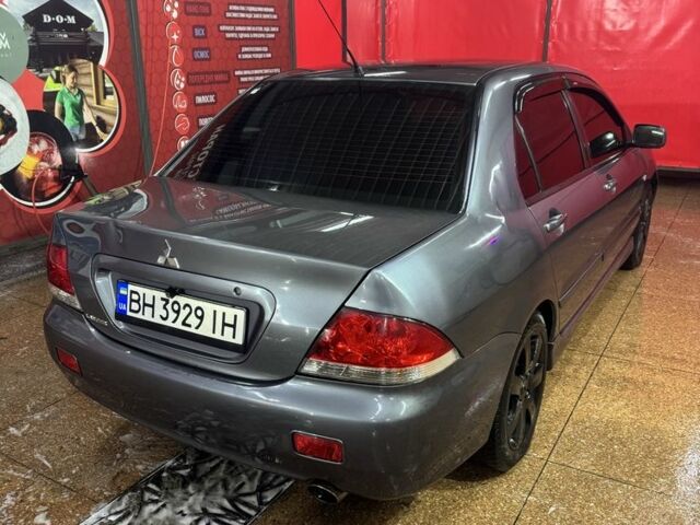 Серый Мицубиси Лансер, объемом двигателя 1.6 л и пробегом 268 тыс. км за 4600 $, фото 5 на Automoto.ua