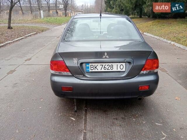 Серый Мицубиси Лансер, объемом двигателя 1.58 л и пробегом 205 тыс. км за 3300 $, фото 2 на Automoto.ua