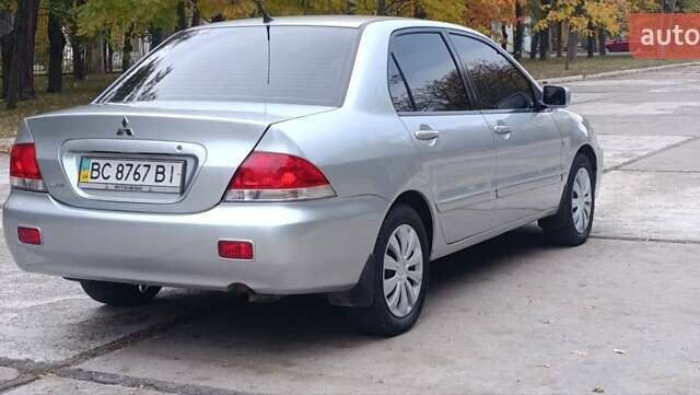 Сірий Міцубісі Lancer, об'ємом двигуна 1.6 л та пробігом 176 тис. км за 4999 $, фото 1 на Automoto.ua