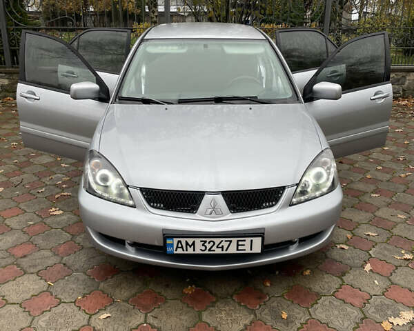 Сірий Міцубісі Lancer, об'ємом двигуна 1.59 л та пробігом 219 тис. км за 4500 $, фото 18 на Automoto.ua