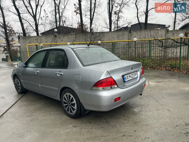 Сірий Міцубісі Lancer, об'ємом двигуна 1.58 л та пробігом 220 тис. км за 5900 $, фото 2 на Automoto.ua