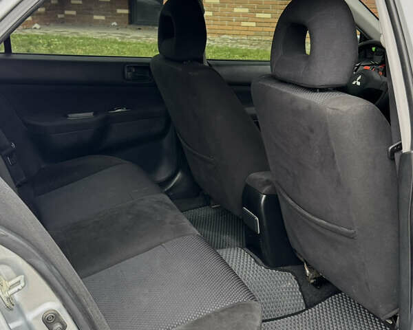 Сірий Міцубісі Lancer, об'ємом двигуна 1.6 л та пробігом 269 тис. км за 3999 $, фото 19 на Automoto.ua