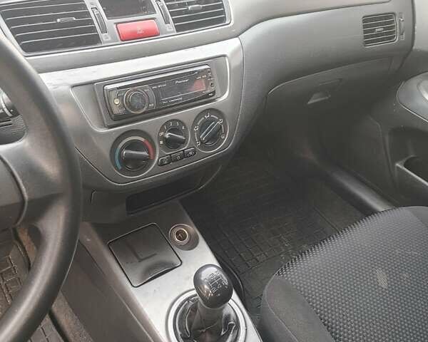 Сірий Міцубісі Lancer, об'ємом двигуна 1.58 л та пробігом 1 тис. км за 2850 $, фото 14 на Automoto.ua