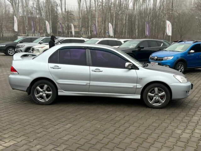 Серый Мицубиси Лансер, объемом двигателя 1.6 л и пробегом 205 тыс. км за 5400 $, фото 7 на Automoto.ua