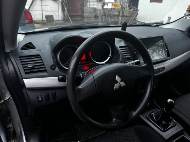 Серый Мицубиси Лансер, объемом двигателя 1.5 л и пробегом 147 тыс. км за 6700 $, фото 11 на Automoto.ua