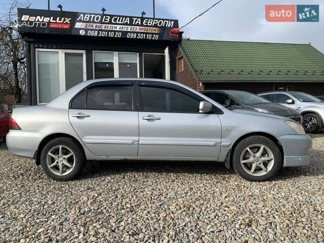 Серый Мицубиси Лансер, объемом двигателя 1.58 л и пробегом 227 тыс. км за 3599 $, фото 1 на Automoto.ua