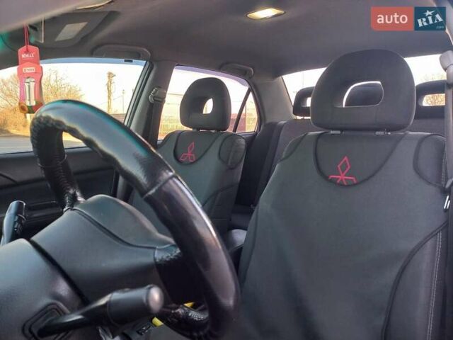 Серый Мицубиси Лансер, объемом двигателя 1.6 л и пробегом 228 тыс. км за 2999 $, фото 32 на Automoto.ua