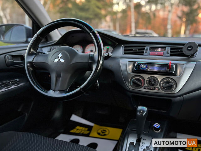 Сірий Міцубісі Lancer, об'ємом двигуна 1.6 л та пробігом 166 тис. км за 5400 $, фото 11 на Automoto.ua