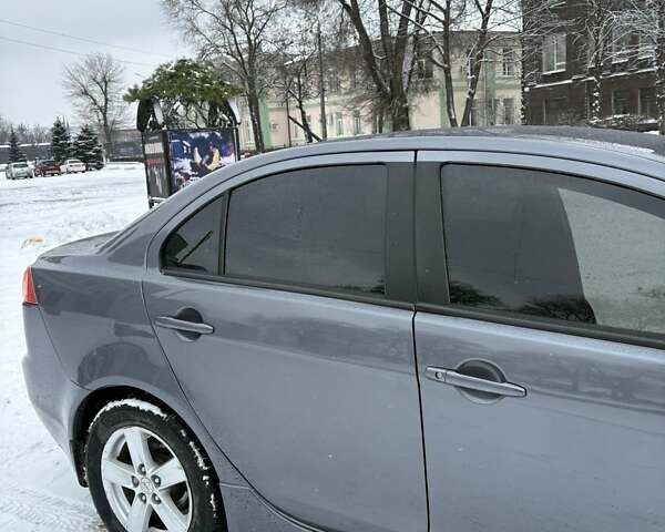 Серый Мицубиси Лансер, объемом двигателя 2 л и пробегом 187 тыс. км за 7000 $, фото 14 на Automoto.ua