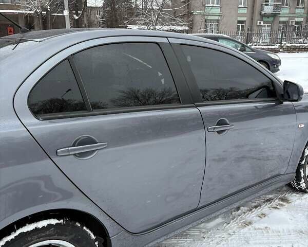 Серый Мицубиси Лансер, объемом двигателя 2 л и пробегом 187 тыс. км за 7000 $, фото 30 на Automoto.ua