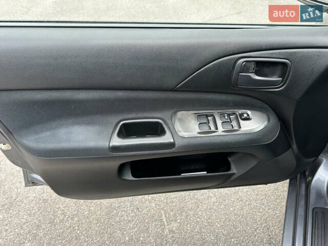 Сірий Міцубісі Lancer, об'ємом двигуна 1.58 л та пробігом 94 тис. км за 6500 $, фото 15 на Automoto.ua
